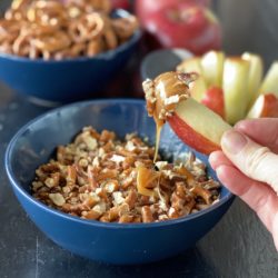 Creamy caramel dip with pretzels and pecans