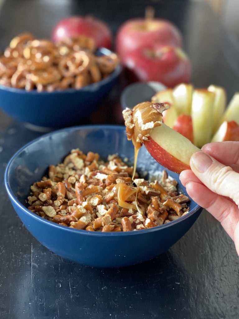 Creamy caramel dip with pretzels and pecans