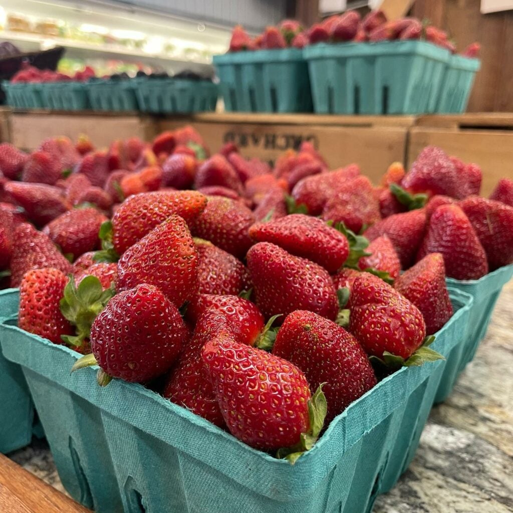 strawberries in green cartons