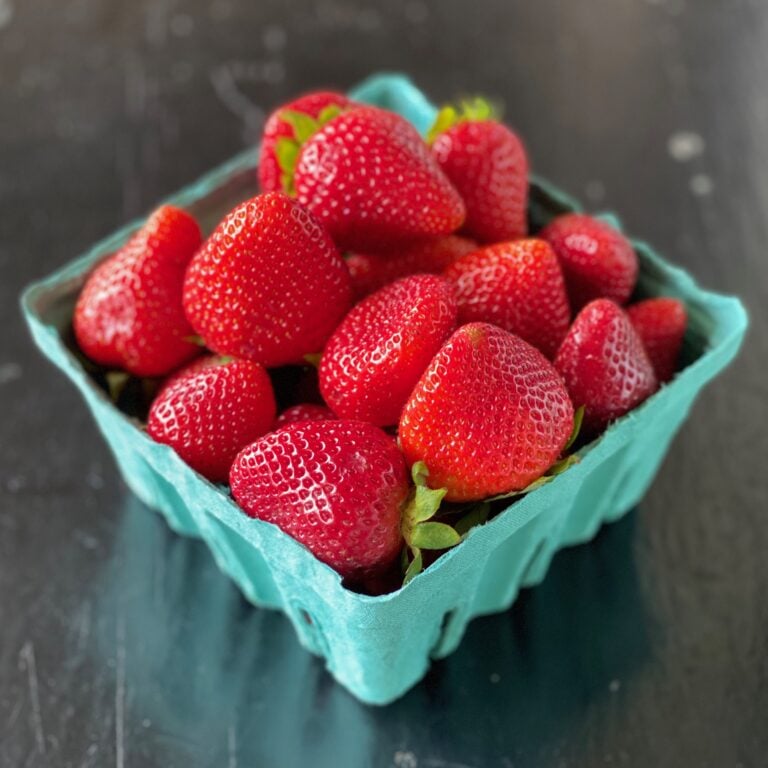 green carton of fresh strawberries